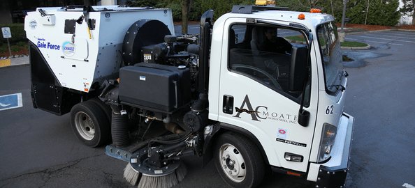 AC Moate Industries branded sweeper truck, commercial lot sweeping service
